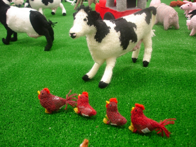 Close up of cow and chickens